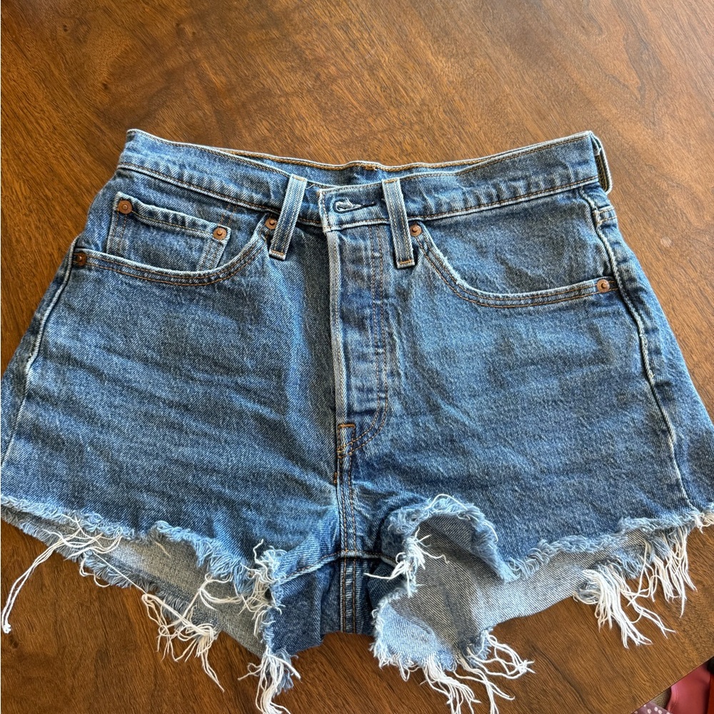 Levi 501s High-Rise Distressed Denim Shorts in Blue -